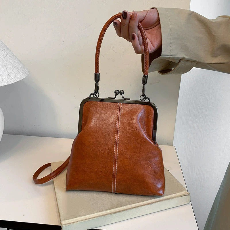 RetroSling™ Borsa a tracolla vintage compatta