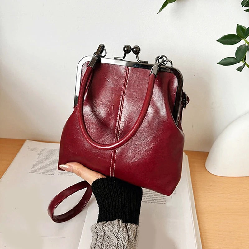 RetroSling™ Borsa a tracolla vintage compatta