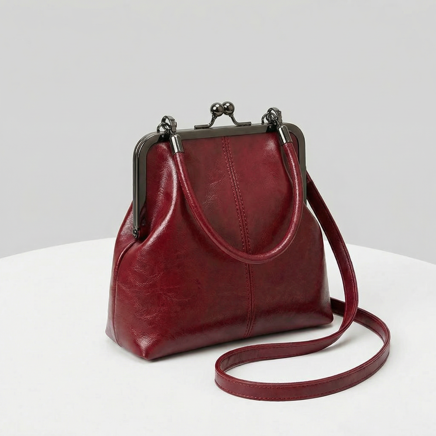RetroSling™ Borsa a tracolla vintage compatta