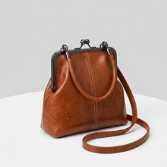 RetroSling™ Borsa a tracolla vintage compatta