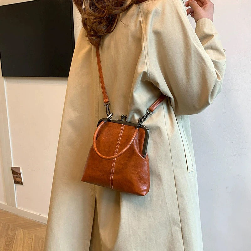 RetroSling™ Borsa a tracolla vintage compatta