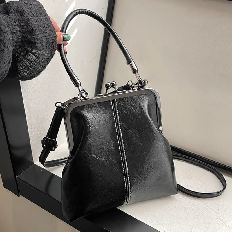 RetroSling™ Borsa a tracolla vintage compatta