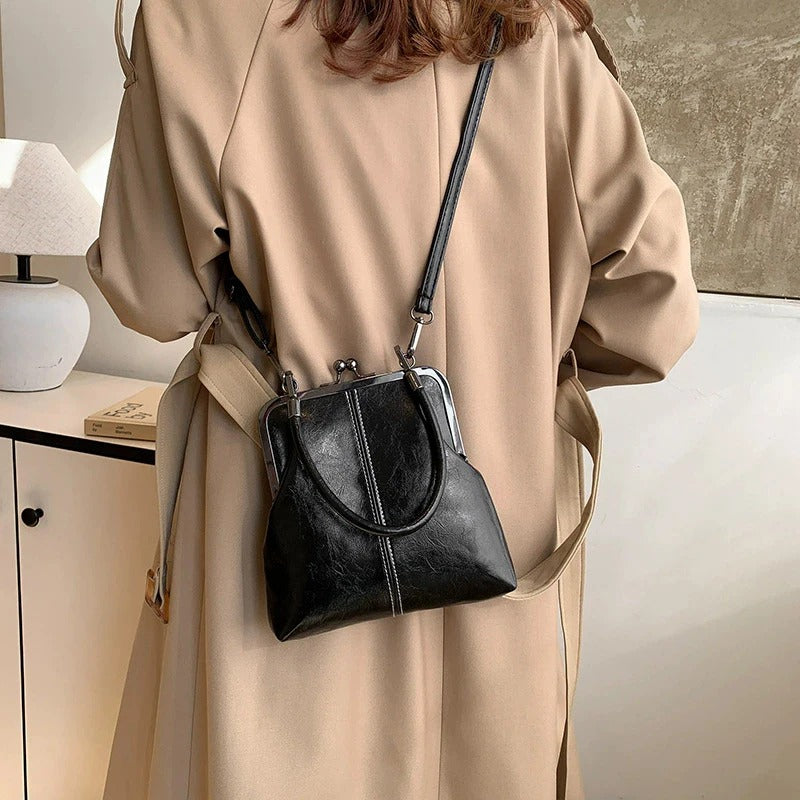 RetroSling™ Borsa a tracolla vintage compatta