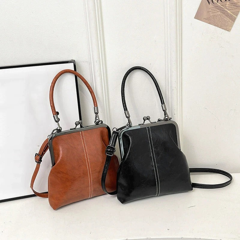 RetroSling™ Borsa a tracolla vintage compatta