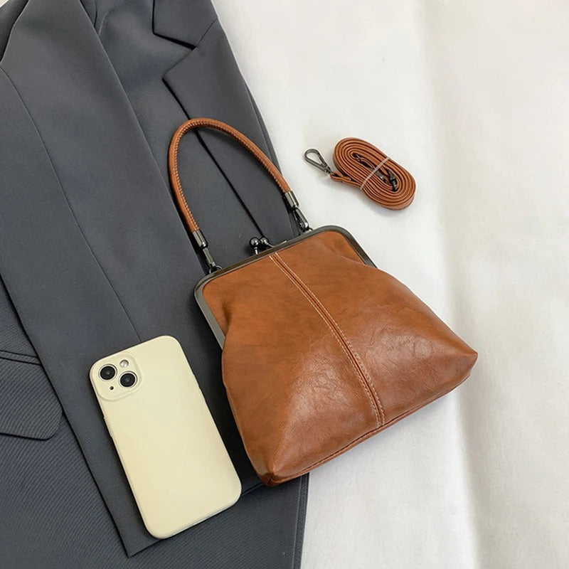 RetroSling™ Borsa a tracolla vintage compatta