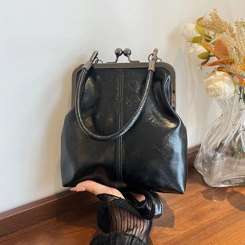 RetroSling™ Borsa a tracolla vintage compatta